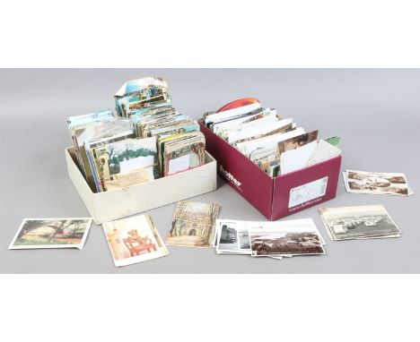 Two boxes of vintage colour postcards.