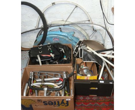 A large quantity of vintage bicycle parts and accessories including luggage bags, mudguards, racer handlebars, tyre pumps etc