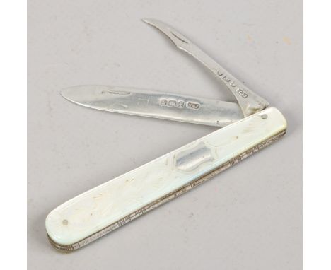 A Victorian silver folding fruit knife with pipper blade and having caved mother of pearl scales by Villiers & Jackson. Assay