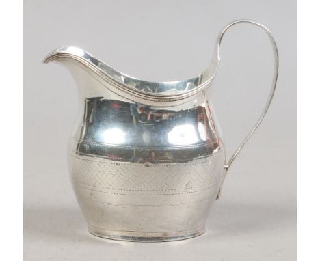 A George III silver helmet shaped cream jug with reeded strap handle, assayed London 1802, 88 grams.