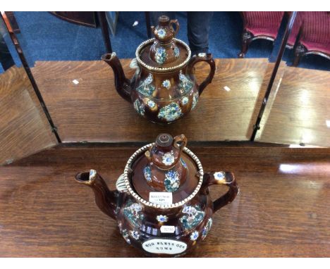 A large ceramic decorative barge ware teapot.