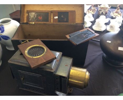 A Magic Lantern together with six slides.