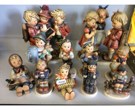 A collection of eleven Hummel W. Gobel figures including two figure groups of school children, and other typical studies of b