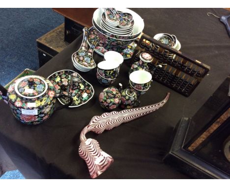 An oriental dinner set including plates, bowls, jugs etc, with an abacus and a Nailsea white and pink pipe.