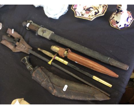 Two bayonets, one guerilla knife, a Wilkinson sword dagger and a knife together with assorted paper work and documents includ