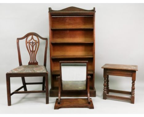 A George III Hepplewhite style mahogany dining chair, an early Victorian mahogany swing toilet mirror, an oak open front book