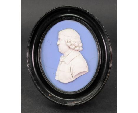 A Wedgwood oval blue jasper portrait medallion, with a profile of Josiah Wedgwood facing to sinister, 10 x 8cm, in moulded eb