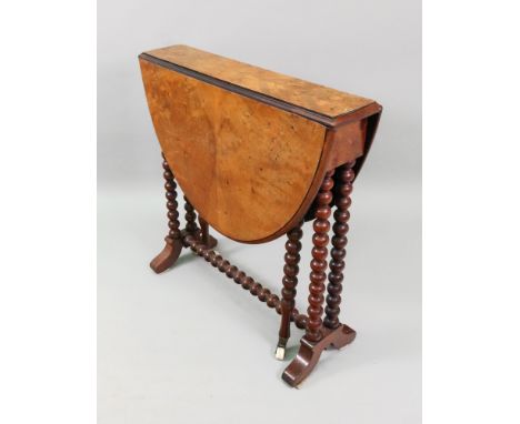 A Victorian walnut Sutherland tea table, the hinged oval figured walnut veneered top on bobbin turned end standards, 80cm wid