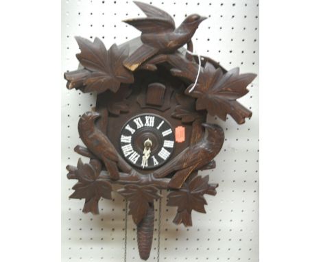 A Swiss stained wood hanging cuckoo clock