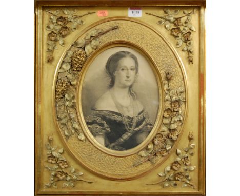 A Victorian monochrome bust portrait print in elaborate gilt and gesso frame