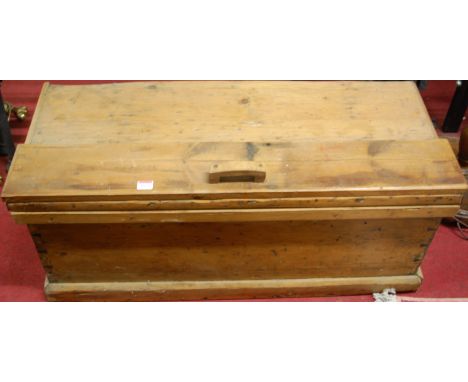 A late Victorian pine hinged top tool chest, with sundry loose contents to include; woodworking planes, chisels, further hand