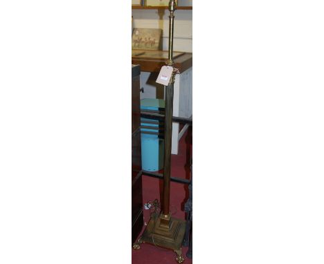 A Corinthian column brass standard lamp, having telescopic action 