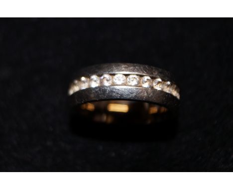 Titanium ring surrounded by white stones 