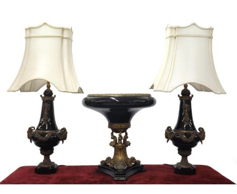 Large pair of decorative black porcelain and gilt metal mounted lamps, modelled with ram's head handles, silk shades, 31.5" h