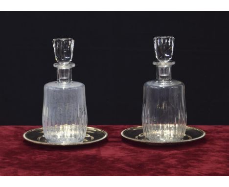 Pair of Baccarat 'Lorraine' clear glass carafes and stoppers, etched mark, each 10" high; mounted upon Mappin &amp; Webb silv