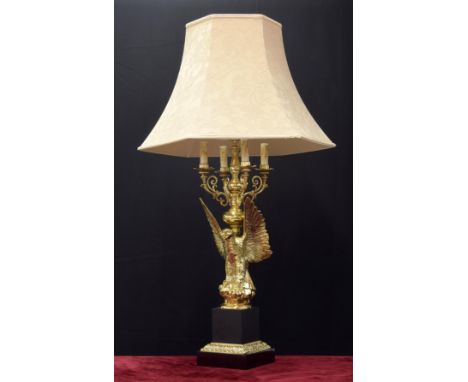 Large decorative and heavy brass lamp in the Classical style, modelled as an open winged eagle upon a square plinth, with sha