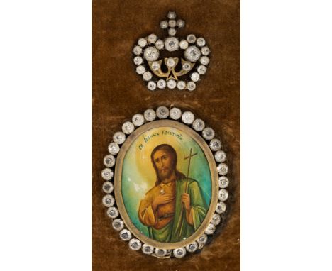 A RUSSIAN ANTIQUE MEDALLION ICON OF SAINT JOHN THE BAPTIST WITH GLASS GEMS, the oval medallion of Saint John the Baptist on a