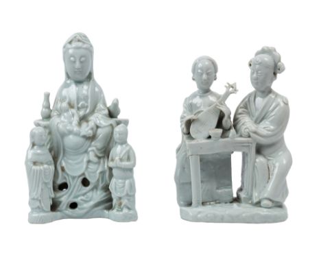 A PAIR OF DEHUA FIGURAL GROUPS, QING DYNASTY, 17-18TH CENTURY,  one depicting Guanyin seated on a pierced rockwork base that 