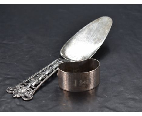 A Norwegian sterling grade white metal cake slice, having a nicely defined and moulded foliate handle over the tapering and r