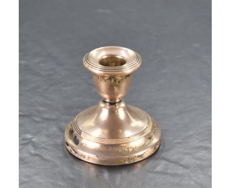 A Queen Elizabeth II silver squat candlestick, with reeded decoration, marks for Birmingham 1958, maker Sanders &amp; Mackenz