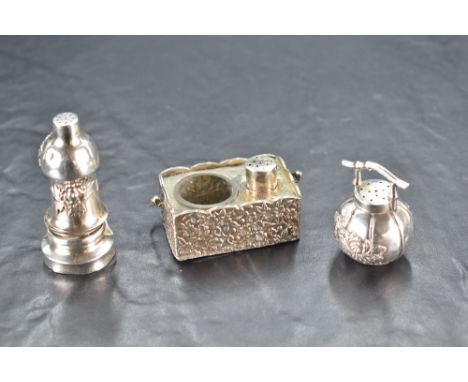 A Japanese sterling grade white metal inkwell, of rectangular form with embossed foliate decoration, swing over-handle, small