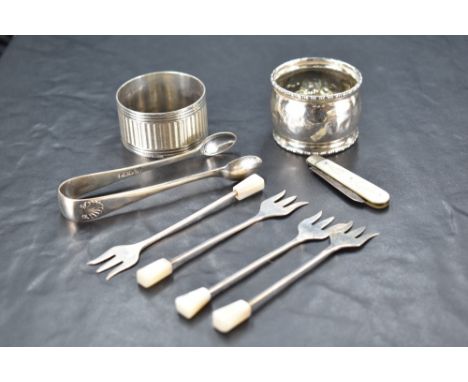 A group of four 1930's mother-of-pearl handled silver pickle tridents, marks for Sheffield 1934, maker Viners, 9cm, sold toge