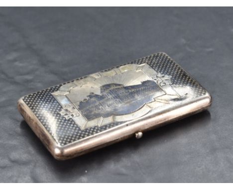 A 19th century Russian white metal Neillo box, of hinged rectangular form, having a central architectural vignette within a s