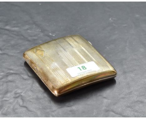 A George V silver cigarette case, of hinged rectangular form, curved for the gentleman's pocket and engine-turned throughout 