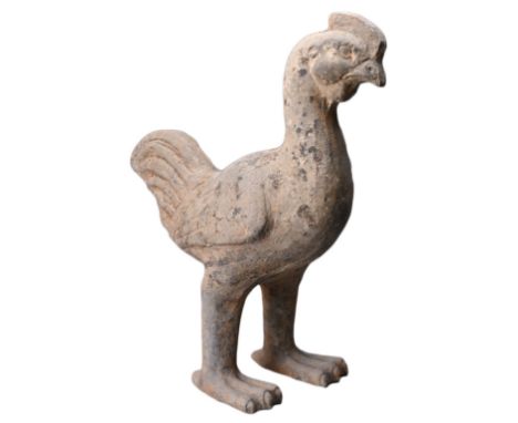 A CHINESE GREY POTTERY MODEL OF A CHICKEN, HAN DYNASTY (206BC-220AD). The moulded figure standing with head slightly turned t