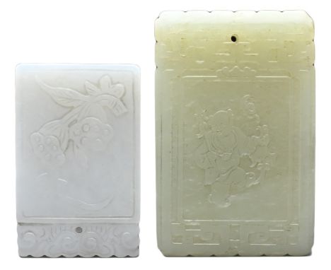 TWO CHINESE JADE PENDANTS. To include a white jade pendant carved in relief with lotus pods and character seal mark to verso 