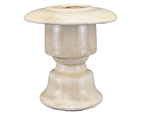A CHINESE WHITE-GLAZED POTTERY OIL LAMP. Covered in a creamy white glaze with areas of crackle. Song dynasty or later. 10cm h