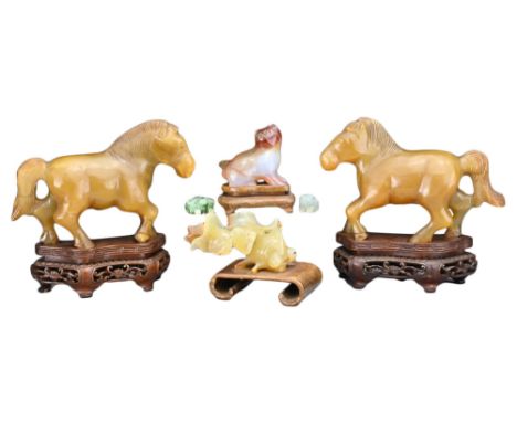 GROUP OF CHINESE JADE AND AGATE CARVINGS, EARLY 20TH CENTURY. To include a pair of horses on pierced wooden stands, an agate 