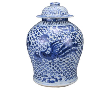 A CHINESE BLUE AND WHITE PORCELAIN PHOENIX JAR AND COVER, 18TH CENTURY. Covered in a scale pattern with peony medallion betwe