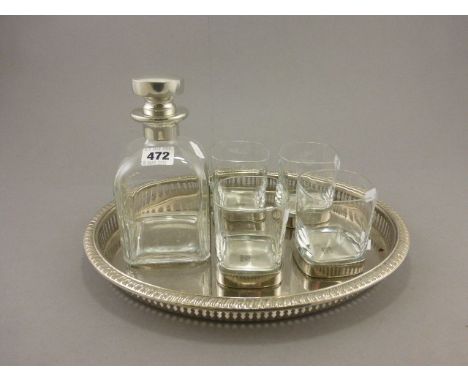 Contemporary Square Glass Decanter together with Four Glass Whiskey Tumblers on White Metal Stands and a Silver Plated Galler