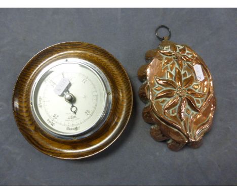 An Oak Framed Barometer and Vintage Copper Jelly Mould 