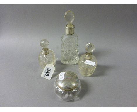 Silver Lidded Glass Powder Pot together with Three Cut Glass Bottles with Silver Bands