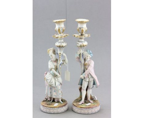 A French Bisque Candle Holders circa 1870, 38cms high 