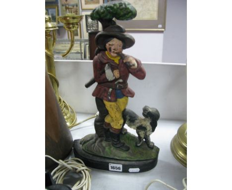 A XIX Century Iron Doorstop, of a man smoking a pipe and a dog.