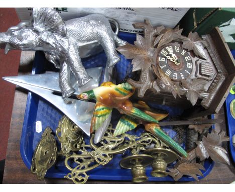 A Continental Carved Wooden Cuckoo Clock, twin weight driven, a pair of cast brass piano candle holders, chrome effect sailin