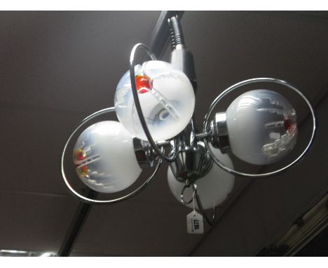 Chrome Four Branch Ceiling Light, circa 1960's/70's, with four chrome hoops housing globular glass shades having red centre t