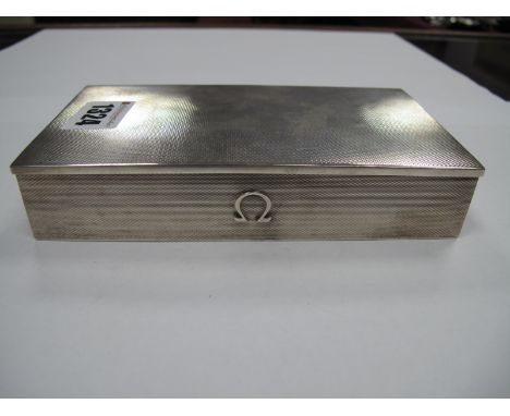 A Hallmarked Silver Cigarette Case, Adie Bros, Birmingham, 1957, of rectangular form, allover engine turned, bearing Omega lo