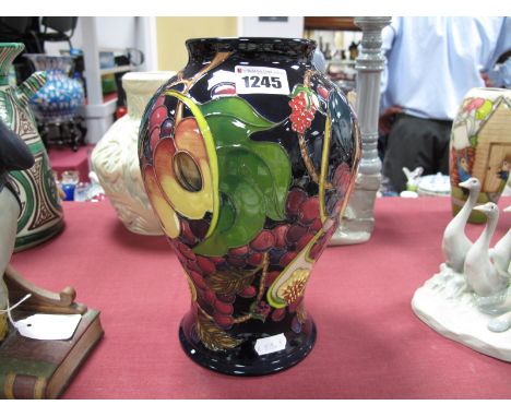 A Moorcroft Pottery Vase, decorated in the 'Queens Choice' design by Emma Bossons, first quality, impressed and painted marks