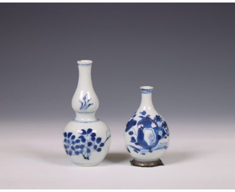 China, two blue and white porcelain vases, Kangxi period (1662-1722), one of double-gourd shape and the other pear-shaped and