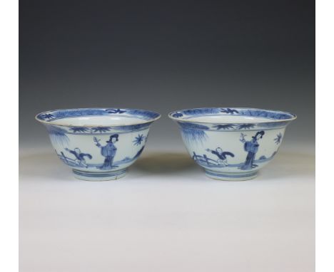 China, pair of blue and white porcelain bowls, Kangxi six-character marks and of the period (1662-1722), each decorated to th