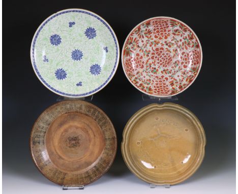 China, four various ceramic dishes, mostly 19th century, comprising a red-decorated peony dish, two brown-glazed dishes and a
