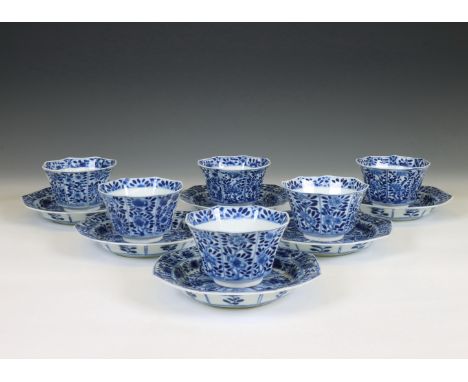 China, a set of seven blue and white porcelain cups and six saucers, Kangxi period (1662-1722), of canted shape and decorated