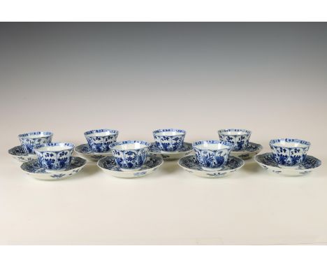 China, a set of eight blue and white porcelain cups and saucers, Kangxi period (1662-1722), each of canted shape and painted 