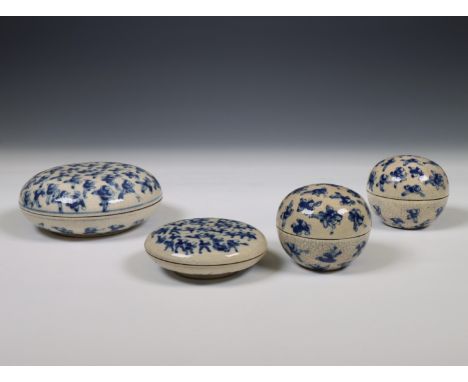 China, four soft paste blue and white 'one hundred boys' boxes, 19th century, each painted with a dense pattern of boys on a 
