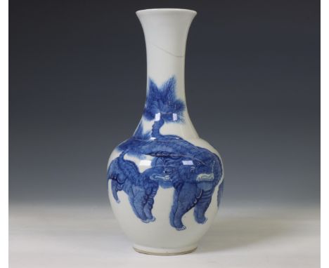 China, blue and white porcelain 'Buddhist lion' bottle vase, 19th century, decorated to the body and elongated neck with a li