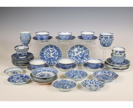 China, a large collection of blue and white porcelain cups and saucers, Kangxi period (1662-1722) and later, mainly painted w